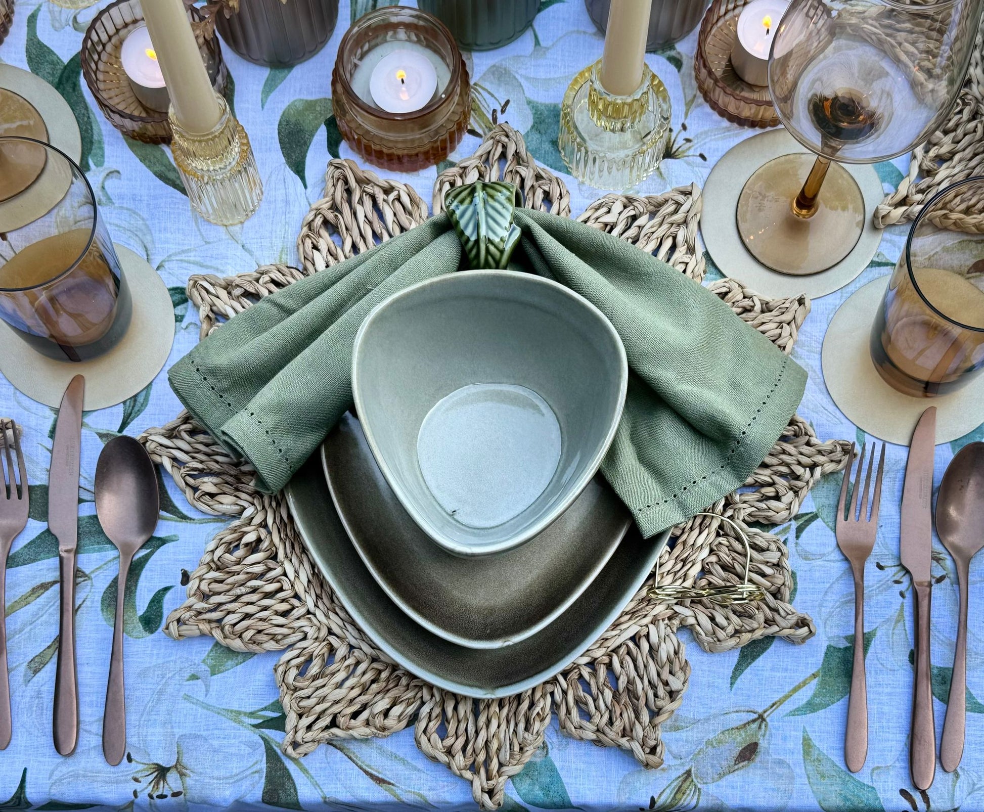 Earthy stoneware plate with taupe linen napkin and gold cutlery styled for effortless dinner hosting