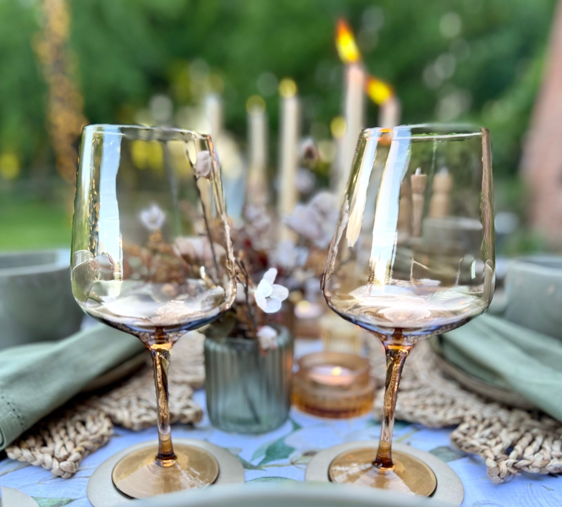Amber glasswear included in rental kit with coordinated crockery, linens, and decorative accents ready for delivery
