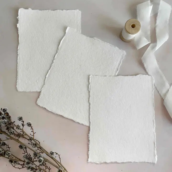 Minimalist place cards set on a curated tablescape for a formal dinner setting